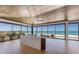 Open living space with full ocean view through walls of floor-to-ceiling glass windows at 5861 Gulf Of Mexico Dr, Longboat Key, FL 34228