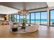 Spacious living area with ocean views, open floor plan, and stylish furnishings at 5861 Gulf Of Mexico Dr, Longboat Key, FL 34228