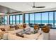 Bright, spacious living room with ocean views and stylish furnishings at 5861 Gulf Of Mexico Dr, Longboat Key, FL 34228