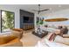 Cozy living room with large sofa, wood accents, and modern design at 5861 Gulf Of Mexico Dr, Longboat Key, FL 34228