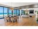 Bright open-plan living area with dining space and beach views at 5861 Gulf Of Mexico Dr, Longboat Key, FL 34228