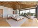 Beautiful bedroom with wood ceiling, large windows and luxurious modern furniture at 5861 Gulf Of Mexico Dr, Longboat Key, FL 34228