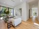 Bright office space with modern furnishings, hardwood floors, and a large window with lush views at 5861 Gulf Of Mexico Dr, Longboat Key, FL 34228