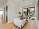 Bright office featuring modern decor, hardwood floors, and a large window with tropical views at 5861 Gulf Of Mexico Dr, Longboat Key, FL 34228