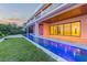 Luxury home featuring a sleek pool and outdoor entertainment area leading to the main building at 5861 Gulf Of Mexico Dr, Longboat Key, FL 34228