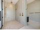 Spacious walk-in shower with dual shower heads and pebble flooring at 5861 Gulf Of Mexico Dr, Longboat Key, FL 34228