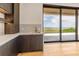 Modern wet bar with custom cabinetry and a view of the ocean at 5861 Gulf Of Mexico Dr, Longboat Key, FL 34228