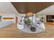 Modern living room with ocean view and unique light fixture at 5861 Gulf Of Mexico Dr, Longboat Key, FL 34228