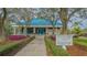 Tennis and Fitness Center with landscaping and walkway at 7506 Eaton Ct, University Park, FL 34201