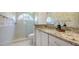 Spa-like bathroom featuring granite countertops, a glass walk-in shower, and ample natural light at 7506 Eaton Ct, University Park, FL 34201