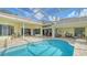 Inviting pool area with a screened enclosure and plenty of seating at 7506 Eaton Ct, University Park, FL 34201