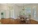 Bright dining area with hardwood floors and views from windows with custom shutters at 7506 Eaton Ct, University Park, FL 34201