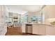 Open concept kitchen featuring stainless steel appliances and views of the living room and lanai at 7506 Eaton Ct, University Park, FL 34201