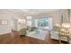 Comfortable living room with hardwood floors and sliding glass doors leading to the pool area at 7506 Eaton Ct, University Park, FL 34201