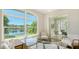 Bright office boasts a gorgeous lake view and convenient access to the lanai at 7506 Eaton Ct, University Park, FL 34201