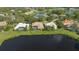 Aerial view of a luxurious home with a pool, nestled in a tranquil community at 7506 Eaton Ct, University Park, FL 34201