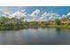 Stunning lake view showcasing a picturesque community at 7506 Eaton Ct, University Park, FL 34201