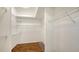 Spacious walk-in closet features custom shelving, hardwood floors, and plenty of room for storage at 7506 Eaton Ct, University Park, FL 34201