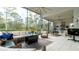 Spacious screened lanai with outdoor seating and a built-in kitchen at 9260 Swaying Branch Rd, Sarasota, FL 34241