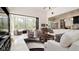 Living area with sliding doors opening to backyard oasis at 9260 Swaying Branch Rd, Sarasota, FL 34241