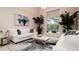Spacious living room with white sofas and large window at 9260 Swaying Branch Rd, Sarasota, FL 34241