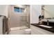 Clean bathroom with walk-in shower, granite countertop and modern fixtures at 9260 Swaying Branch Rd, Sarasota, FL 34241