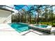 Relaxing pool and spa with screened enclosure, offering a private oasis at 9260 Swaying Branch Rd, Sarasota, FL 34241