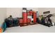 Well-organized garage with laundry facilities and exercise equipment at 9260 Swaying Branch Rd, Sarasota, FL 34241