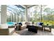 Spacious screened lanai with comfortable seating and a view of the pool at 9260 Swaying Branch Rd, Sarasota, FL 34241