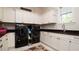 Well-lit laundry room featuring a washer, dryer, and stylish cabinetry at 9260 Swaying Branch Rd, Sarasota, FL 34241