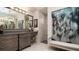 Elegant bathroom with double vanity, large mirror and walk in shower at 9260 Swaying Branch Rd, Sarasota, FL 34241