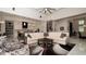 Open concept living room with adjacent kitchen view at 9260 Swaying Branch Rd, Sarasota, FL 34241