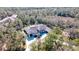 Luxury home surrounded by lush trees and landscaping at 9260 Swaying Branch Rd, Sarasota, FL 34241