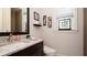 Clean bathroom with granite countertop, modern vanity, and a toilet at 9260 Swaying Branch Rd, Sarasota, FL 34241