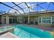 Inviting pool and spa with a screened enclosure at 10209 Discovery Ter, Bradenton, FL 34212