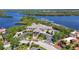 Aerial view of the beautiful community clubhouse, waterfront marina, and lush surroundings at 10209 Discovery Ter, Bradenton, FL 34212