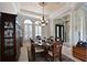 Elegant dining room with a large table and chandelier at 10209 Discovery Ter, Bradenton, FL 34212