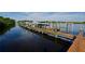 Several boats docked at a marina with calm water reflections at 10209 Discovery Ter, Bradenton, FL 34212