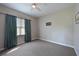 Spacious bedroom with neutral carpeting and ample natural light at 10209 Discovery Ter, Bradenton, FL 34212