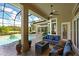 Covered patio overlooking the pool and lush landscaping at 10209 Discovery Ter, Bradenton, FL 34212