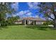 Stunning two-story home with lush landscaping and manicured lawn at 10209 Discovery Ter, Bradenton, FL 34212