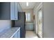 Convenient laundry room with cabinets, counter space, washer, dryer, utility sink and exterior access at 10209 Discovery Ter, Bradenton, FL 34212
