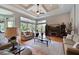 Bright living room with hardwood floors, large windows, and comfortable seating area at 10209 Discovery Ter, Bradenton, FL 34212