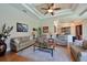 Comfortable living room featuring hardwood floors and a view into the kitchen at 10209 Discovery Ter, Bradenton, FL 34212