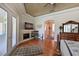 Spacious main bedroom with a fireplace, hardwood floors, and access to the outdoors at 10209 Discovery Ter, Bradenton, FL 34212