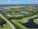 Aerial view of golf course community with various water features at 10209 Discovery Ter, Bradenton, FL 34212