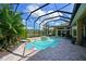 Inviting pool area featuring a screened enclosure, perfect for relaxation and outdoor enjoyment at 10209 Discovery Ter, Bradenton, FL 34212
