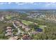 Bird's-eye view of a waterfront community with golf course and luxury homes at 10209 Discovery Ter, Bradenton, FL 34212