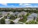 Aerial view of a residential neighborhood showcasing houses and landscaping at 12224 Longview Lake Cir, Bradenton, FL 34211