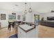 Open-concept kitchen featuring a breakfast bar that overlooks the dining area and living room at 12224 Longview Lake Cir, Bradenton, FL 34211